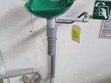 a green sink sitting next to a green fire hydrant