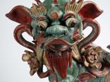 a statue of a dragon that is sitting on a table