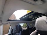 a view of the sunroof from inside of a car