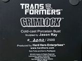 a sign that says transformers grimlock on the side of a building