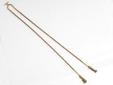 a pair of gold chains with tassels hanging from them