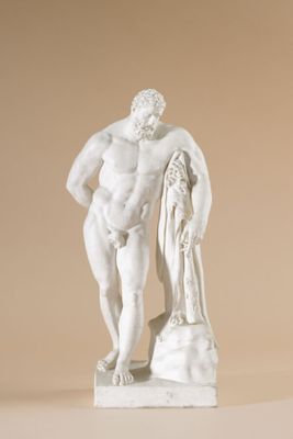 a statue of a man standing next to a statue of a woman