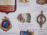 a lot of badges that are on a piece of paper