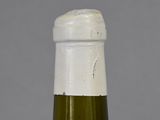 a close up of a bottle of wine on a table