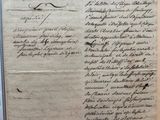an old document with writing on it sitting on top of a table