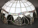 a stained glass lamp that is sitting on a table
