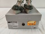 a pair of shoes that are on top of a box