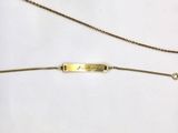 two gold necklaces with a bar on the front and a bar on the back