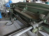 an image of a machine that is working on a piece of metal