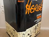 a black box with an orange writing on it on the floor