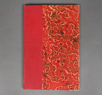 a red notebook with a floral design on it