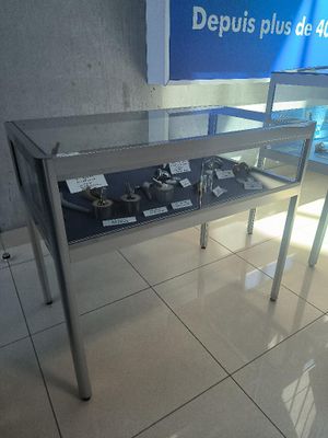 a table with a display of items on it in a store