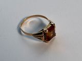 a close up of a ring with a stone in it
