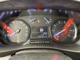 a close up of a car dashboard with a speedometer and gauges