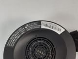 a close up of a blow dryer sitting on top of a white surface