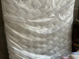 a mattress that has been wrapped up in plastic
