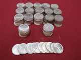 a pile of silver coins next to a pile of silver coins