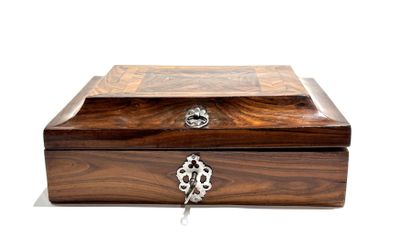 a wooden box with a lock on it on a white surface