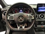 the interior of a car with a steering wheel and dashboard controls