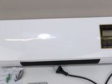 a white electronic device sitting on top of a table