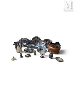 a pile of assorted metal items on a white surface