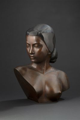 bronze bust of a woman with a turban on her head