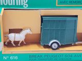 a box with a toy horse and a truck in it