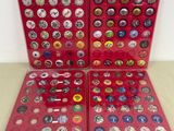 two red cases with buttons in them on a table