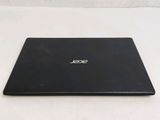 a laptop that is sitting on a white surface