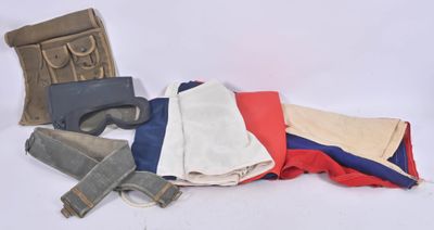 a pile of clothes and a gun on a white surface