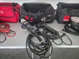 a table with a bunch of tools and a bag on it