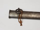 a metal pipe with a rope hanging from it