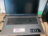 a laptop that is sitting on a desk next to a printer