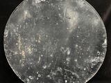 a large metal plate with a lot of spots on it