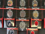 a lot of badges that are on a black table
