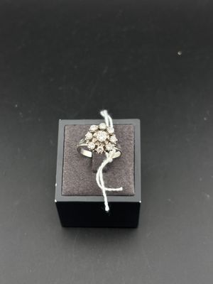 a close up of a ring in a box on a table