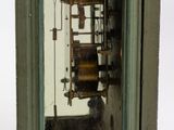 a small clock that is sitting on a table