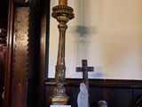 a clock and a candle on a table in a room