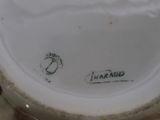 a close up view of a vase with a name on it
