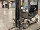 a fork lift truck parked in a warehouse area