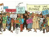 many people holding signs and flags in a crowd