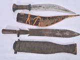 several different types of knives are displayed on a white surface