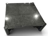 a metal table with a black top on a white surface