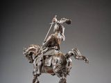 an image of a statue of a man on a horse with a spear