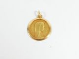 an image of a gold coin with a woman ' s face on it