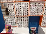 a lot of glasses on the shelves in the store