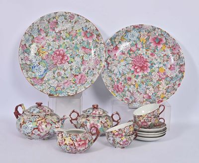 a group of plates and cups and saucers with flowers on them