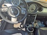 a car dashboard with a steering wheel and a dash board