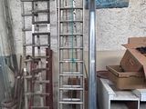 many different types of ladders in a garage