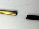 a picture of a bullet and a lighter on a table